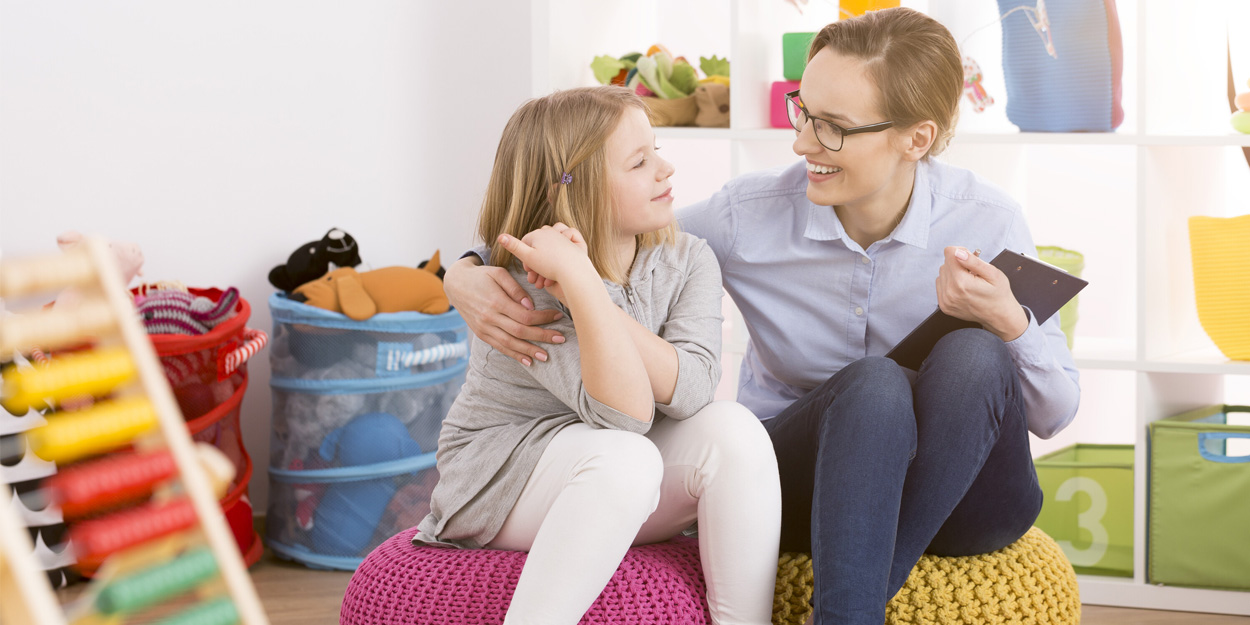 Teacher having a conversation with a student